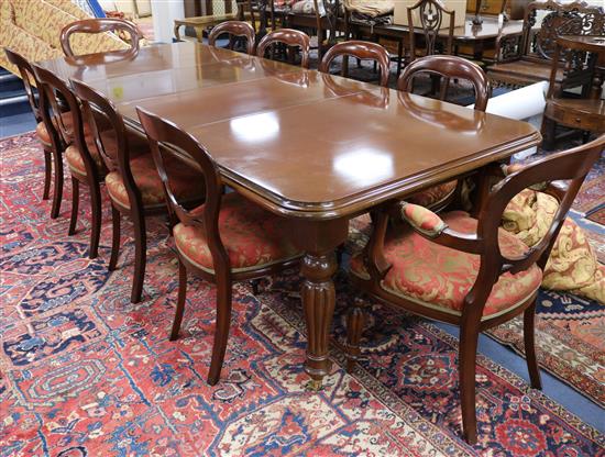 A Victorian style mahogany extending table and ten mahogany chairs 8ft 8in. x 3ft 8in.